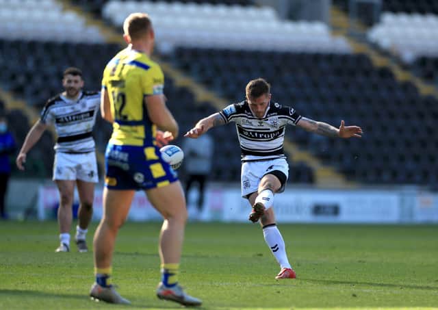 Hull FC's Marc Sneyd attempts a drop goal. Picture: PA.