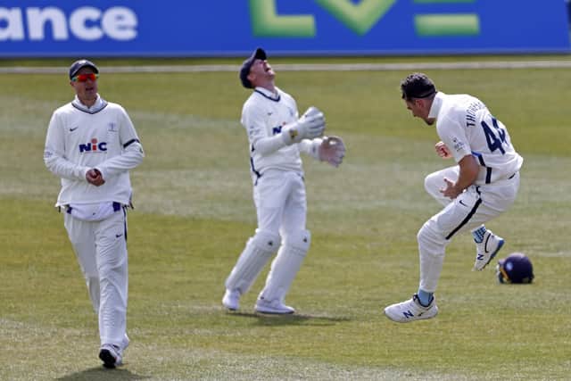 Yorkshire's Jordan Thompson (R) celebrates taking the wicket of Joe Denly.