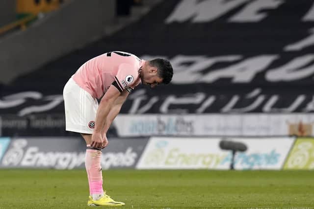 John Egan of Sheffield Utd looks on dejected at the final whistle (Picture: Andrew Yates / Sportimage)