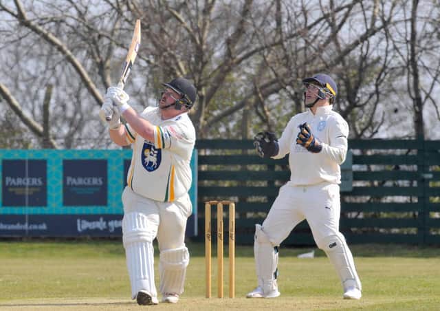 Contribution: Pudsey St Lawrence captain Chris Marsden, left,  scored 32 runs and took five wickets.. (Picture: Steve Riding)