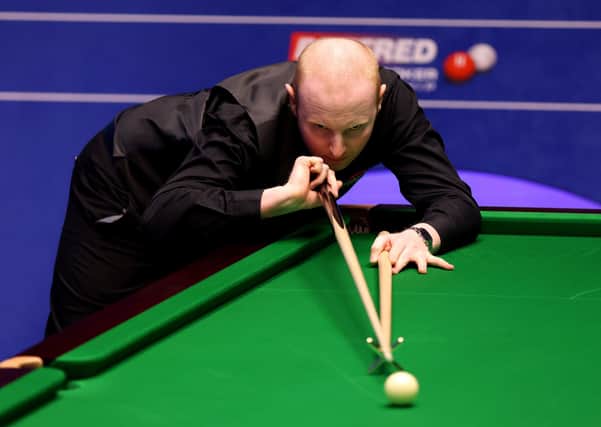 Anthony McGill uses the rest during his match against Ricky Walden at The Crucible on Monday. Picture: George Wood/PA