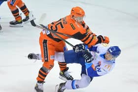 TAKE THAT: Steelers' Rob Dowd lands a hit on a Coventry opponent. Picture: Dean Woolley.