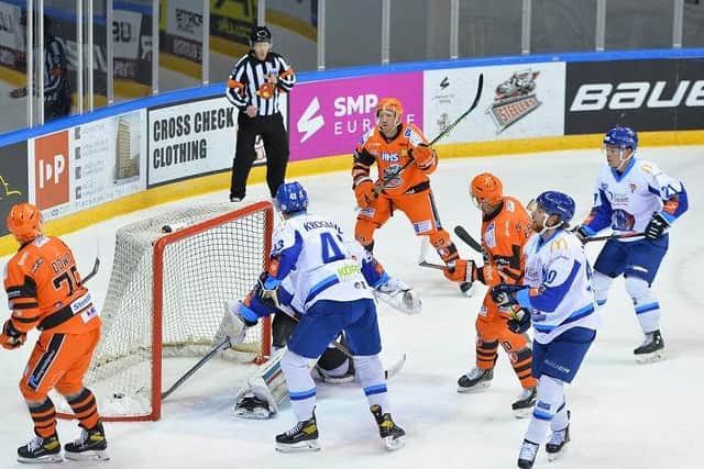 STRIKE ONE: Brendan Connolly, top, equalises for Sheffield Steelers in the 10th minute. Picture courtesy of Dean Woolley.