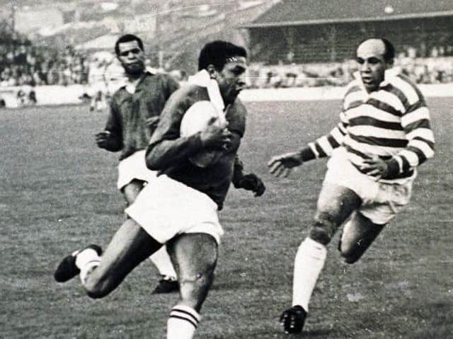 Clive Sullivan on the ball with Billy Boston and Colin Dixon in 1968.