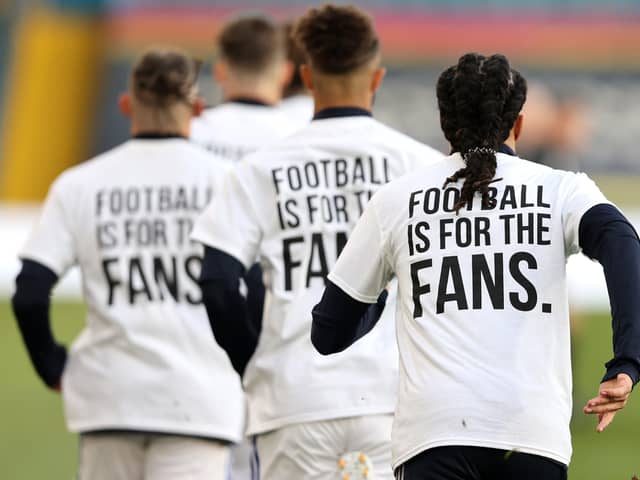 Clear message: Leeds United players wearing 'Football Is For The Fans' shirts as Liverpool arrive at Elland Road. Picture: PA