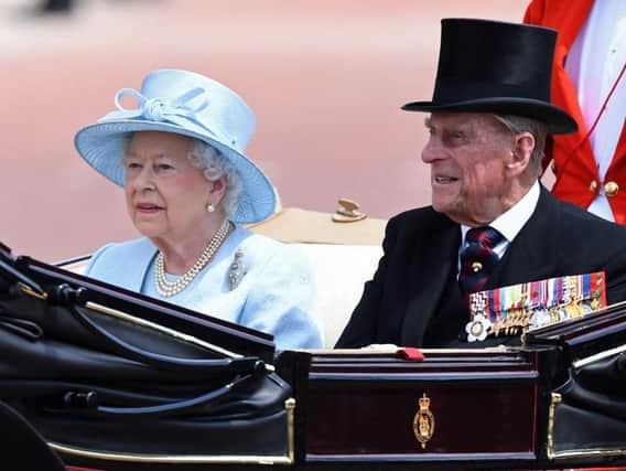 Queen Elizabeth and her late husband Prince Philip. Photo by CHRIS J RATCLIFFE/AFP via Getty Images.