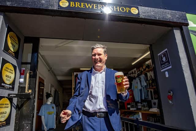 Labour leader Sir Keir Starmer pulls a pint and drinks it during a visit to Wrexham Larger Brewery in Wrexham as part of Welsh Labour's Senedd election campaign. Picture: Peter Byrne/PA Wire