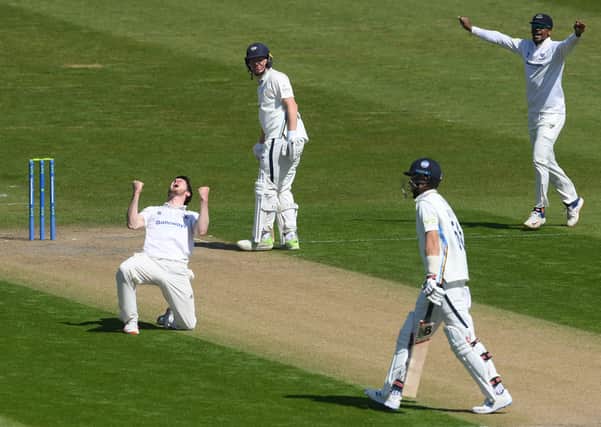 Sussex's George Garton celebrates after trapping Yorkshire's Joe Root lbw.  (Photo by Mike Hewitt/Getty Images)