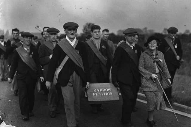 1936:  A group of protesters carrying the petition on the Jarrow Crusade,  a demonstration march by unemployed men from shipyard town of Jarrow, Tyneside, who walked to London to demand the right to work.  (Photo by Fox Photos/Getty Images)