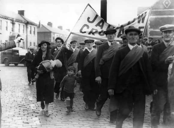 1st October 1936:  Protest marchers starting out on the Jarrow Crusade, a demonstration march by unemployed men from the shipyard town of Jarrow, Tyneside, who walked to London to demand the right to work.  (Photo by Central Press/Getty Images)