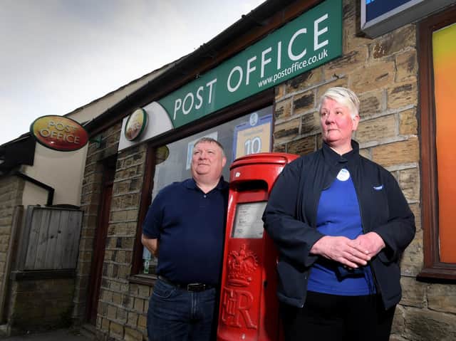 Alison Hall with her husband Richard pictured outside the Post Office, Halifax Road, Liversedge Picture: Simon Hulme
