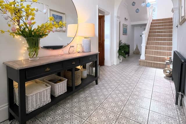 Melissa Abbott's home near Ripon - the beautiful large hallway to the Victorian house features a period archway through to the stairs and the back of the house. It has recently been tiled in these striking Mediterranean style tiles.