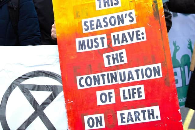 Extinction Rebellion protest outside Store X on the Strand, London, during London Fashion Week February 2020. Photo: Katie Collins/PA Wire