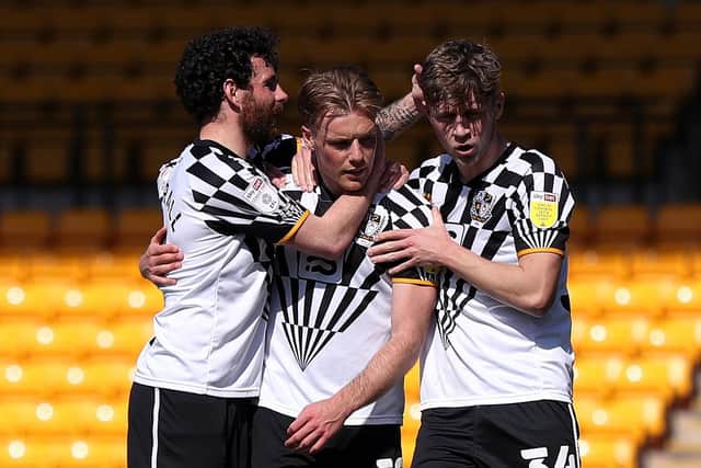 WINNING STRIKE: Tom Conlon of Port Vale celebrates with David Worrall and Will Swan after scoring their side's second goal from the penalty spot during the Sky Bet League Two match between Port Vale and Bradford City. Picture: Getty Images.