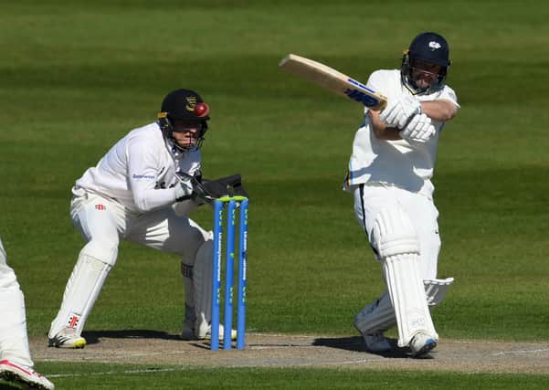 Yorkshire's Adam Lyth pulls for four to reach his 50 at Hove. (Pictures: Mike Hewitt/Getty Images)