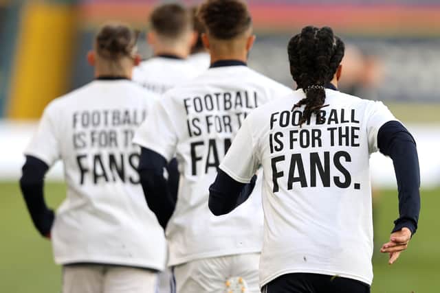 Leeds United players wearing 'Football Is For The Fans' shirts. Picture: PA.
