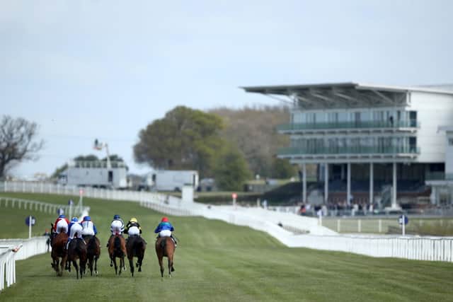 Sign of the times: Runners and riders pass the empty stands during The Watch Racing TV In Stunning HD Novice Stakes at Wetherby Racecourse yesterday. Picture: Tim Goode/PA Wire.