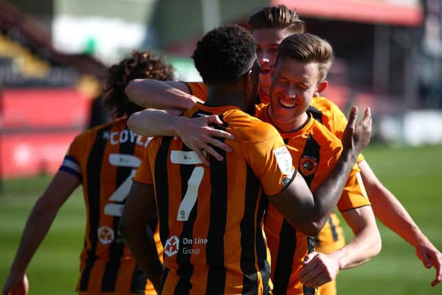 CELEBRATIONS: Hull City's players lap up Mallik Wilks's winning penalty
