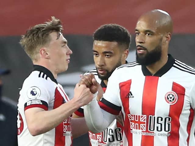 David McGoldrick is congratulated after opening the scoring during Sheffield United's Premier League clash with Brighton & Hove Albion. Pictures: Getty Images