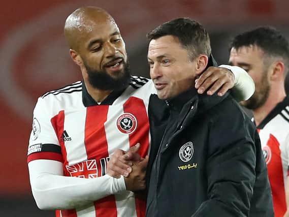 Sheffield United match-winner David McGoldrick, left, and interim manager Paul Heckingbottom celebrate at full-time following Saturday's win over Brighton. Pictures: Getty Images