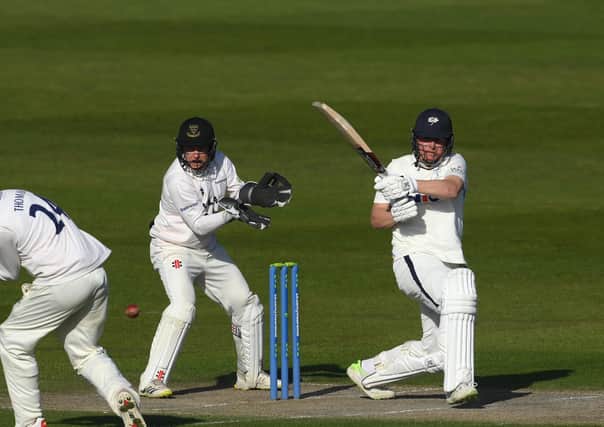 LEADING MAN: Yorkshire's Gary Ballance pulls a boundary as Sussex's Aaron Thomason takes evasive action on day two of the COunty Championship clash at Hove. Picture: Mike Hewitt/Getty Images