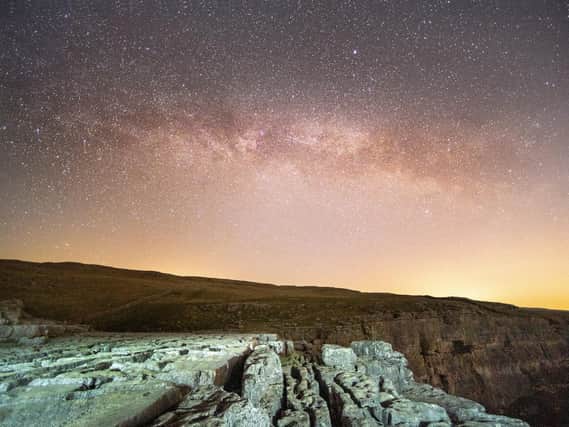 Bruce Rollinson's image of the Milky Way above Malham Cove in the Yorkshire Dales. Technical details: Nikon D6, 14mm f2.8 Nikkor,  20sec @ f2.8, 5000 iso.