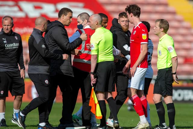 Plenty to say: Players and officials from both Barnsley and Rotherham, including injured Millers keeper Viktor Johansson haves words with referee Gavin Ward at the end of the game.
  Picture Bruce Rollinson