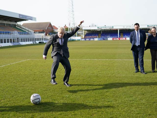 Prime Minister Boris Johnson kicking a football during a visit to the Hartlepool United Football Club, in Hartlepool, ahead of the May 6 by-election. Picture: Ian Forsyth/PA