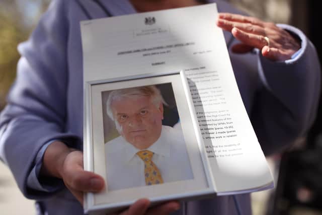 Karen Wilson, widow of postmaster Julian Wilson who died in 2016, holds a photograph of her husband outside the Royal Courts of Justice, London, after his conviction was overturned by the Court of Appeal. Thirty-nine former subpostmasters who were convicted of theft, fraud and false accounting because of the Post Office's defective Horizon accounting system have had their names cleared by the Court of Appeal.