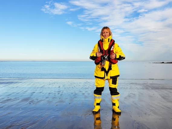 Image of RNLI volunteer Becs Miller issued by charity as it reveals rising number of rescues carried out last summer