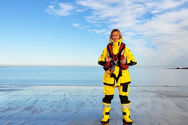 Image of RNLI volunteer Becs Miller issued by charity as it reveals rising number of rescues carried out last summer