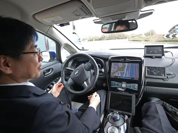 A self-driving car being tested. Such vehicles could be seen on British roads for the first time later this year, the Government has revealed. Pic: PA