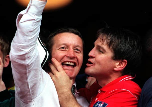 On the up: John Hendrie  threatens to plant a kiss on the cheek of manager Danny Wilson.