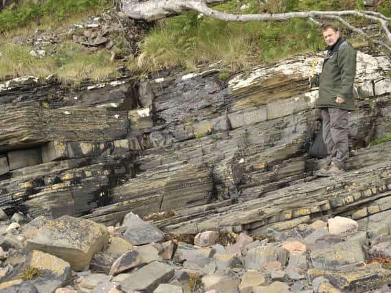 Pictured, Professor Charles Wellman, one of the lead investigators of the research, from the University of Sheffield at Loch Torridon, where the fossil was discovered. Photo credit: The University of Sheffield