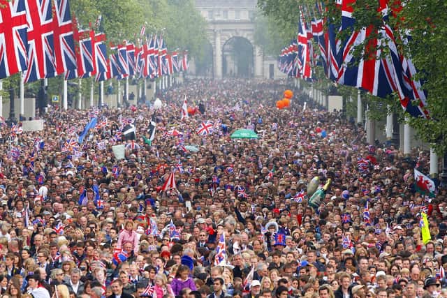 Crowds line the Mall outside Buckingham Palace following the wedding in 2011.