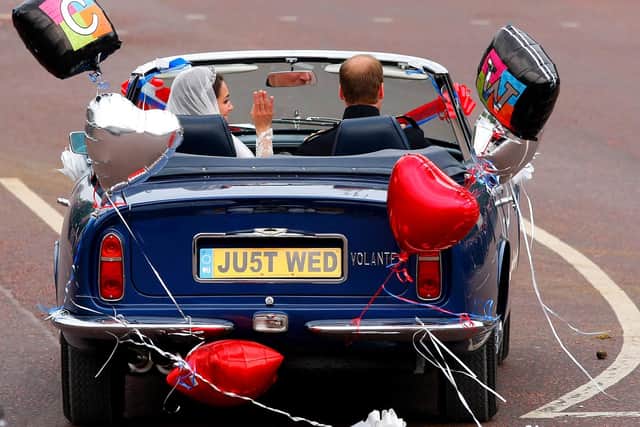 Prince William drives himself and his wife Kate as they leave Buckingham Palace for Clarence House after the wedding.