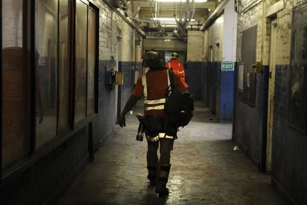 A miner walks to the showers after his last shift as UK deep coal mining comes to an end in 2015 at Kellingley Colliery. Image: Bruce Rollinson.