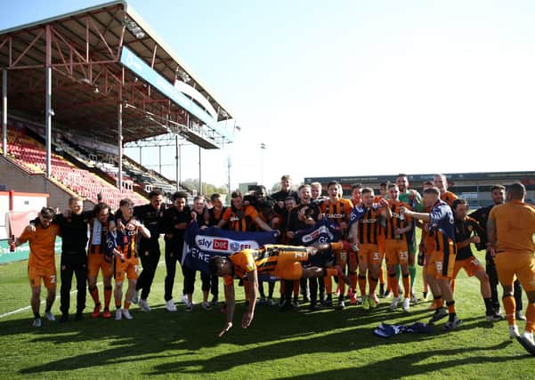 Hull City's players celebrate promotion to the Championship at Lincoln. Picture: Tim Goode/PA