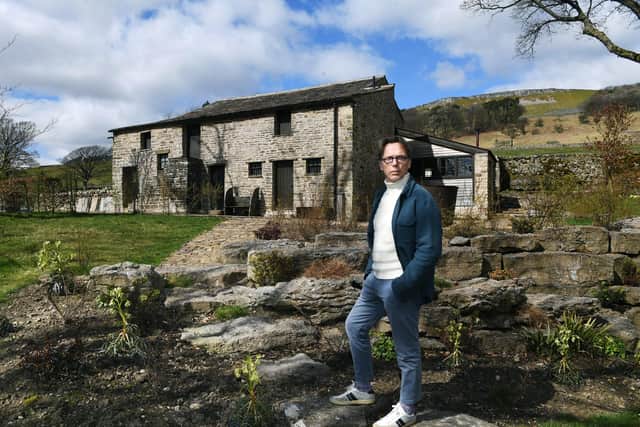 Artist and former fashion designer Graeme Black, pictured outside the Yorkshire Dales barn he has converted into his studio. 
Picture: Jonathan Gawthorpe