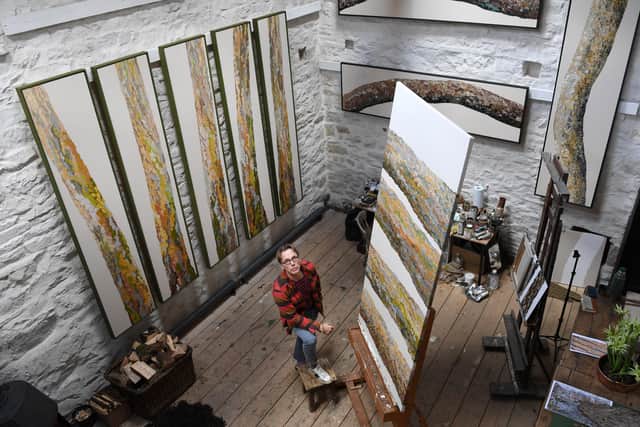 Graeme Black, surrounded in his studio by his portraits of trees.
Picture: Jonathan Gawthorpe