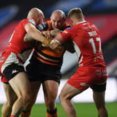 Milestone: Nathan Massey, centre, pictured playing against Salford last season, will rack up his 250th Tigers appearance against the same opposition tonight. (Picture: Jonathan Gawthorpe)