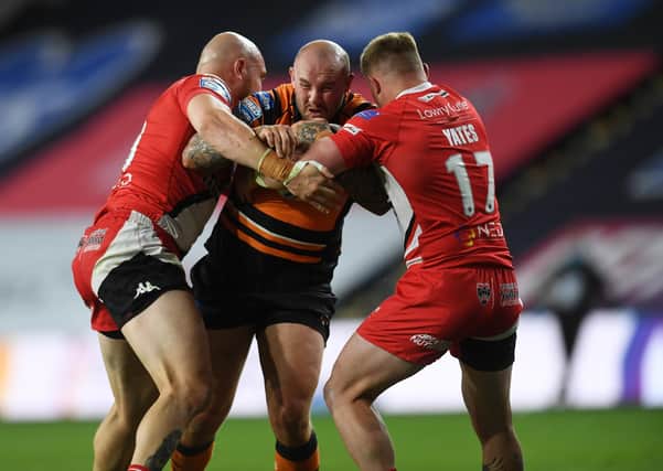 Milestone: Nathan Massey, centre, pictured playing against Salford last season, will rack up his 250th Tigers appearance against the same opposition tonight. (Picture: Jonathan Gawthorpe)