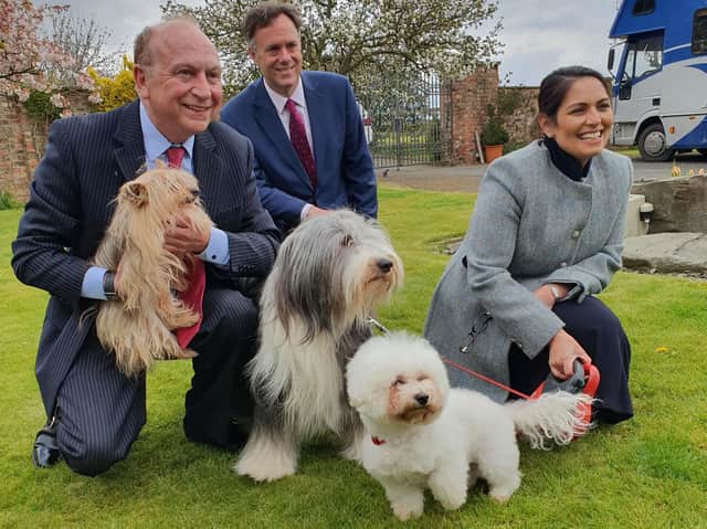 Home Secretary Priti Patel (right) on a visit to a kennels in York today. She was there in support of PCC candidate Philip Allot (left) and was joined by York MP Julian Sturdy (centre)