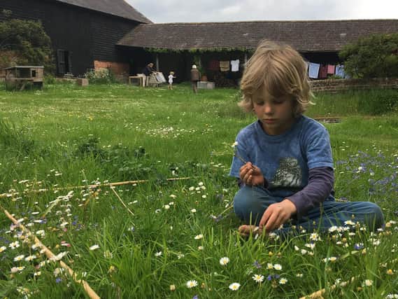 Boy counting flowers as part of Every Flower Counts (c) Archie Thomas
