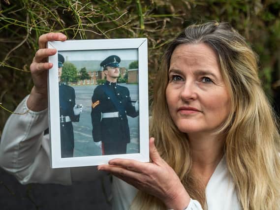 Lisa Craig-Crawford with a picture of her husband Steve, who died in 2017. Picture: James Hardisty