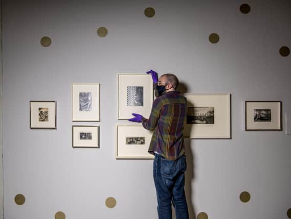 Curator Ashley Gallant with Cecil Beaton’s Bright Young Things hung ready  for the reopening of the Millennium Gallery in Sheffield. The new exhibition comes direct from the National Portrait Gallery, London. Picture Tony Johnson