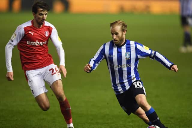 UNCERTAINTY: Rotherham United's Dan Barlaser and Sheffield Wednesday's Barry Bannan both go into the final week of the season not knowing what division their club will be in next season