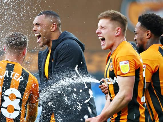 Hull City players celebrate after beating Wigan Athletic 3-1 to wrap up the League One title. Pictures: Getty Images