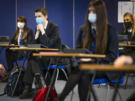 Pupil's at AB's school have been 'required' to wear facemasks, a court was told, but the trust running the school said students were 'encouraged' to wear them