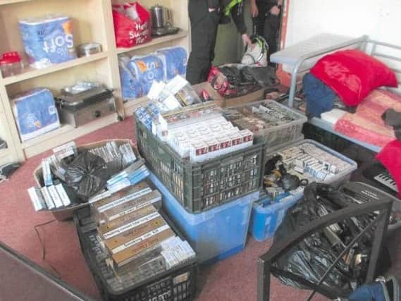 Some of the illegal cigarettes and tobacco worth £50,000 seized in a raid at Polski Sklep in Dewsbury